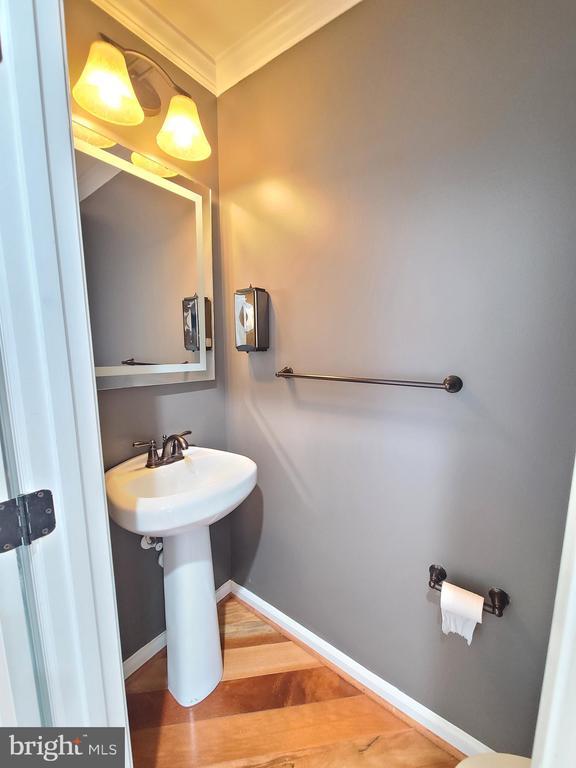 9423 Reservoir Rd, Fredericksburg, VA 22407 - bathroom featuring ornamental molding, wood finished floors, and baseboards
