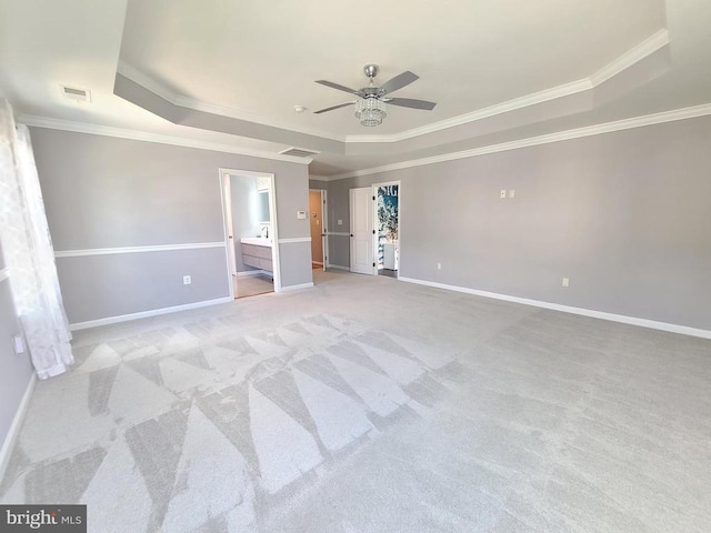 9423 Reservoir Rd, Fredericksburg, VA 22407 - unfurnished bedroom with a tray ceiling, crown molding, light carpet, and baseboards