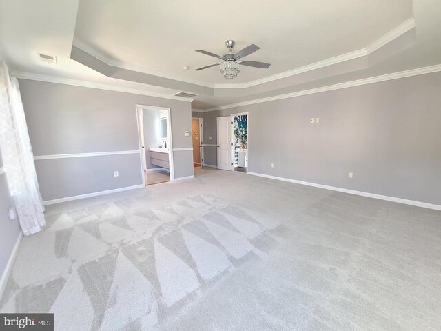 9423 Reservoir Rd, Fredericksburg, VA 22407 - unfurnished bedroom with a raised ceiling, ornamental molding, light colored carpet, ensuite bath, and ceiling fan