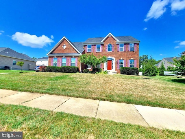 9423 Reservoir Rd, Fredericksburg, VA 22407 - colonial-style house with brick siding and a front yard