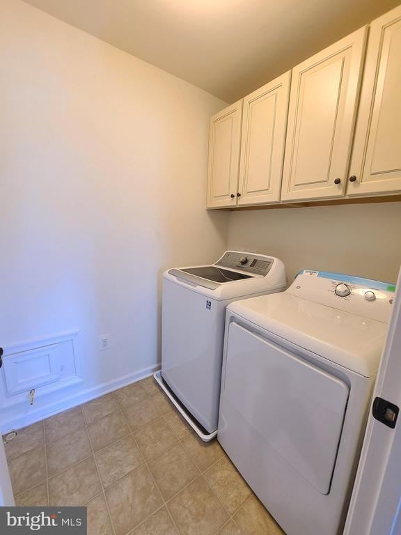 9423 Reservoir Rd, Fredericksburg, VA 22407 - laundry area with cabinet space, independent washer and dryer, and baseboards