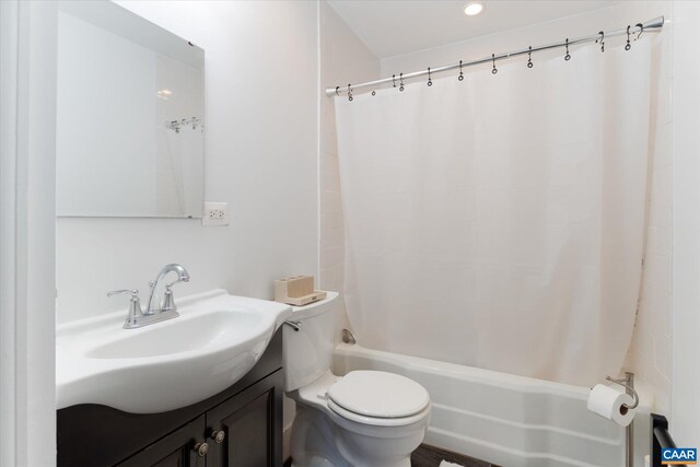 bathroom featuring toilet, shower / bathtub combination with curtain, vanity, and recessed lighting