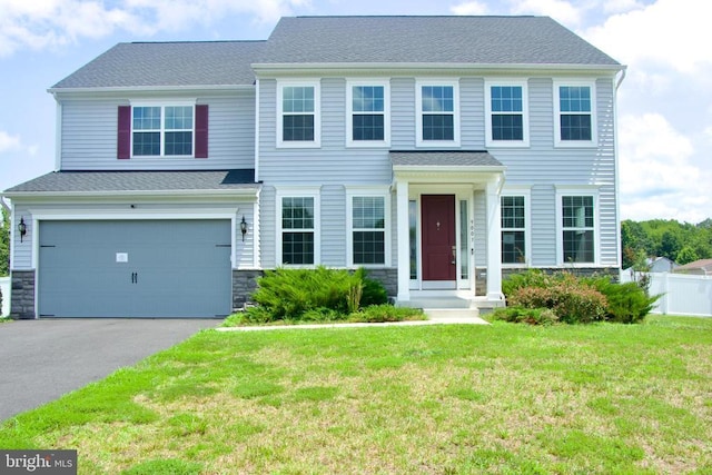 9003 Walnut Hill Rd, Fredericksburg, VA 22408 - view of front facade featuring a garage, stone siding, and driveway