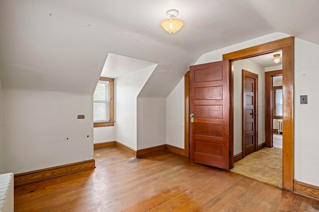 917 Chestnut Dr, Harrisonburg, VA 22801 - additional living space with light wood-style flooring, lofted ceiling, baseboards, and radiator heating unit