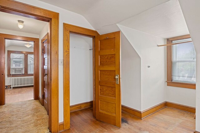 917 Chestnut Dr, Harrisonburg, VA 22801 - additional living space with radiator, light wood-type flooring, vaulted ceiling, baseboards, and cooling unit