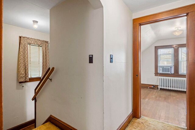 917 Chestnut Dr, Harrisonburg, VA 22801 - corridor with radiator heating unit, arched walkways, baseboards, vaulted ceiling, and wood finished floors