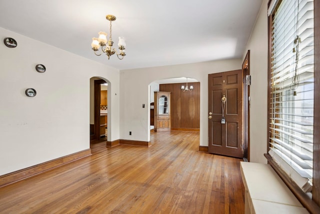 917 Chestnut Dr, Harrisonburg, VA 22801 - entrance foyer featuring a chandelier, arched walkways, plenty of natural light, and light wood-style floors