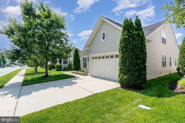6304 Dranesville Dr W, Fredericksburg, VA 22407 - view of home's exterior with concrete driveway, a garage, and a yard