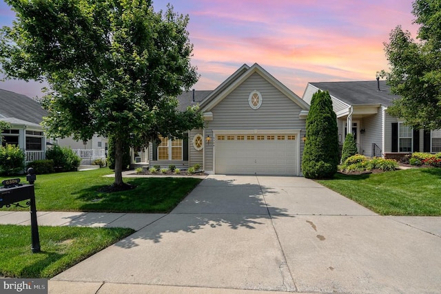6304 Dranesville Dr W, Fredericksburg, VA 22407 - view of front of property featuring driveway, an attached garage, and a lawn