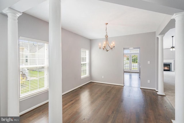 6304 Dranesville Dr W, Fredericksburg, VA 22407 - spare room with dark wood finished floors, a glass covered fireplace, ornate columns, and a chandelier