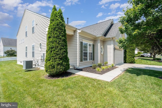 6304 Dranesville Dr W, Fredericksburg, VA 22407 - view of side of home featuring a garage, a shingled roof, a lawn, and concrete driveway