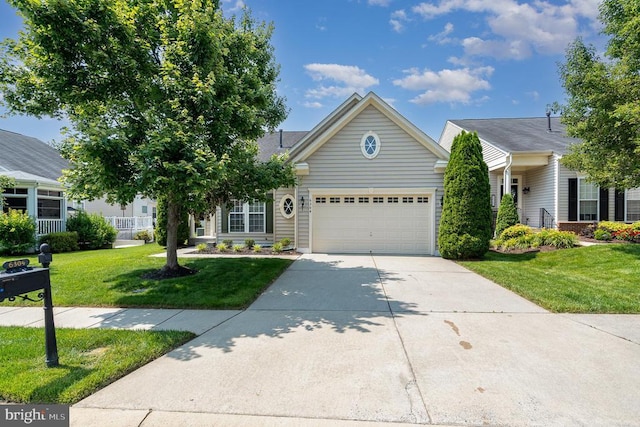 6304 Dranesville Dr W, Fredericksburg, VA 22407 - view of front of property featuring concrete driveway, a garage, and a front yard