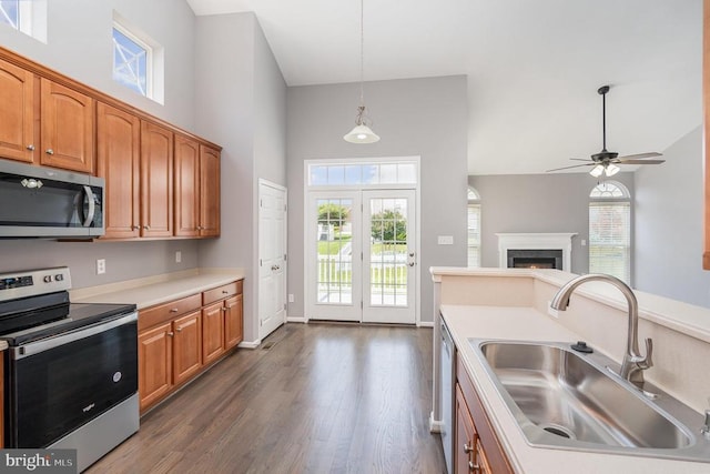 6304 Dranesville Dr W, Fredericksburg, VA 22407 - kitchen with stainless steel appliances, a towering ceiling, dark wood finished floors, light countertops, and ceiling fan