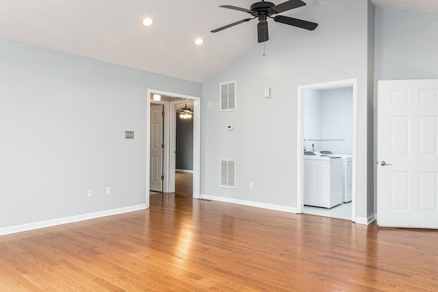 unfurnished room with ceiling fan, light wood-style floors, visible vents, and washer and dryer