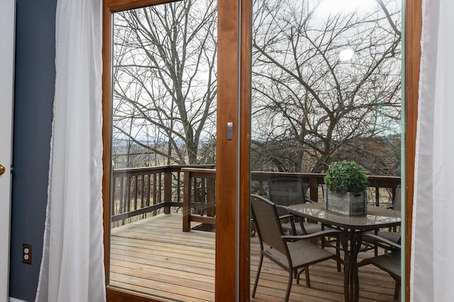 wooden terrace with outdoor dining space