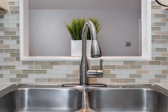 details with tasteful backsplash and a sink