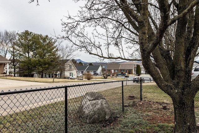 view of yard featuring a residential view and fence