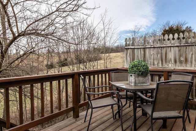 wooden terrace with outdoor dining area