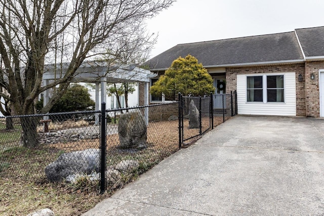 view of front of house with roof with shingles, fence, and brick siding