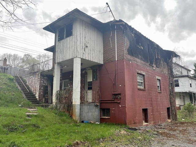 view of property exterior featuring stairs
