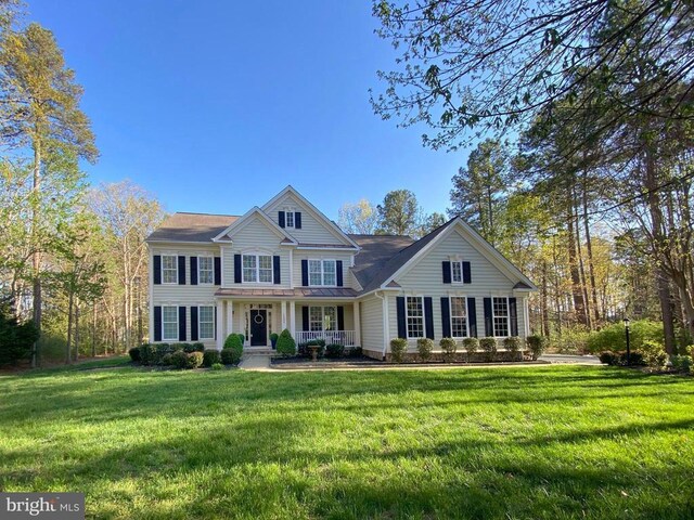11304 Chivalry Chase Ln, Spotsylvania, VA 22551 - view of front facade featuring a porch and a front lawn