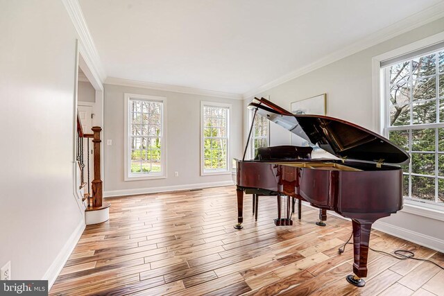 11304 Chivalry Chase Ln, Spotsylvania, VA 22551 - living area featuring baseboards, crown molding, wood finished floors, and stairway