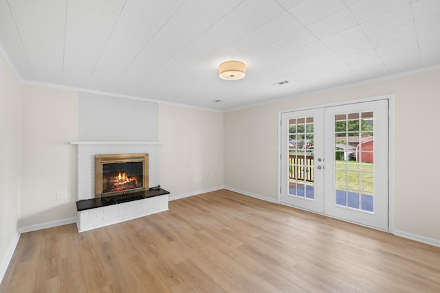 96 Featherstone Dr, Lyndhurst, VA 22952 - unfurnished living room with ornamental molding, wood finished floors, french doors, a fireplace, and baseboards