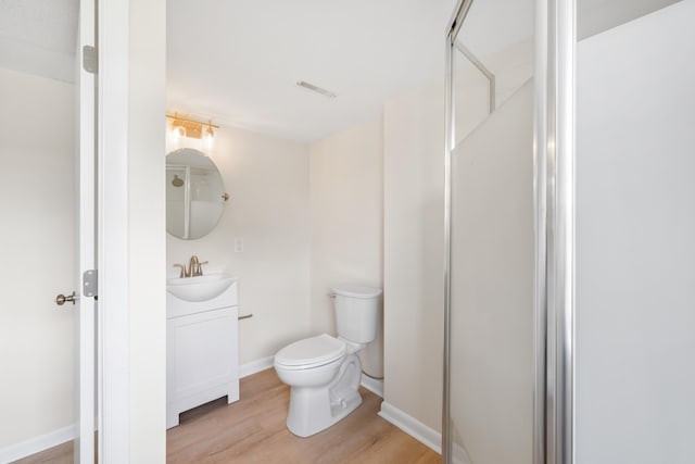 96 Featherstone Dr, Lyndhurst, VA 22952 - bathroom with vanity, wood finished floors, toilet, baseboards, and a shower