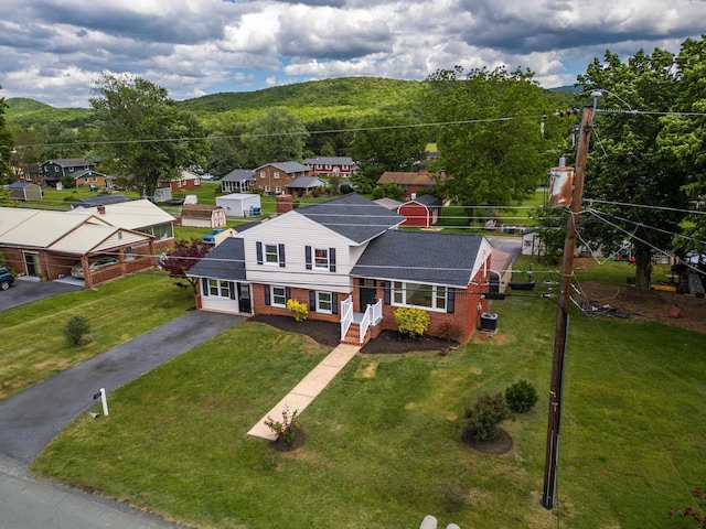 96 Featherstone Dr, Lyndhurst, VA 22952 - view of front of property with driveway, brick siding, a front yard, a residential view, and a shingled roof