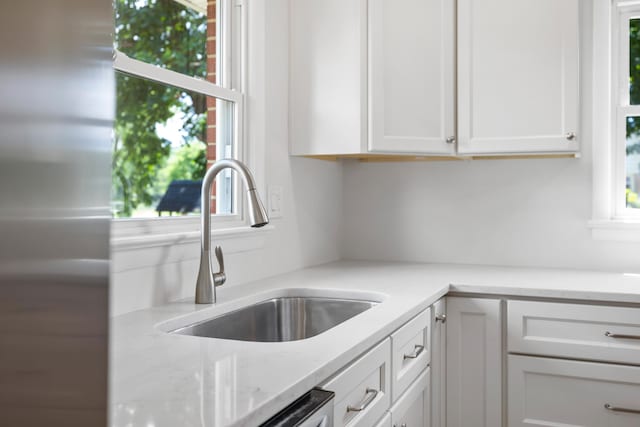 96 Featherstone Dr, Lyndhurst, VA 22952 - kitchen with a sink, white cabinets, stainless steel fridge, and light stone counters