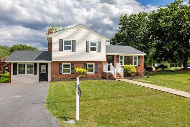 96 Featherstone Dr, Lyndhurst, VA 22952 - tri-level home featuring brick siding, a chimney, asphalt driveway, and a front lawn