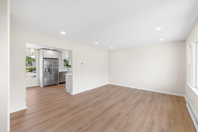 96 Featherstone Dr, Lyndhurst, VA 22952 - unfurnished living room featuring a baseboard radiator, light wood finished floors, recessed lighting, and baseboards