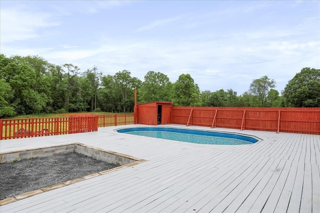210 Jackson Ave, New Market, VA 22844 - view of swimming pool with a wooden deck and a fenced backyard