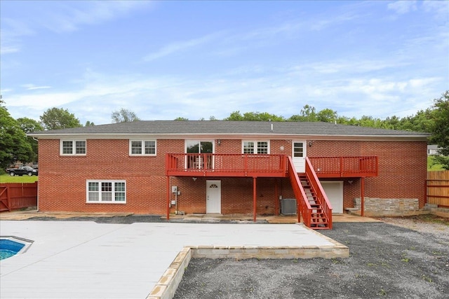 210 Jackson Ave, New Market, VA 22844 - rear view of property featuring a wooden deck, a patio area, stairway, and brick siding