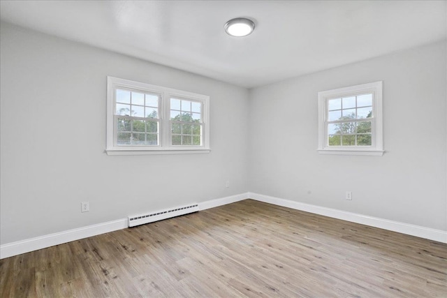 210 Jackson Ave, New Market, VA 22844 - spare room with a baseboard radiator, wood finished floors, and baseboards