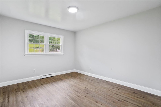 210 Jackson Ave, New Market, VA 22844 - unfurnished room with wood finished floors, baseboards, and baseboard heating