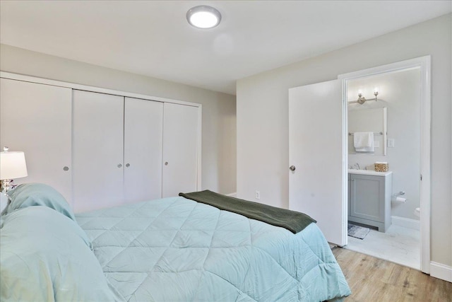 210 Jackson Ave, New Market, VA 22844 - bedroom featuring light wood-style floors, a closet, and ensuite bath