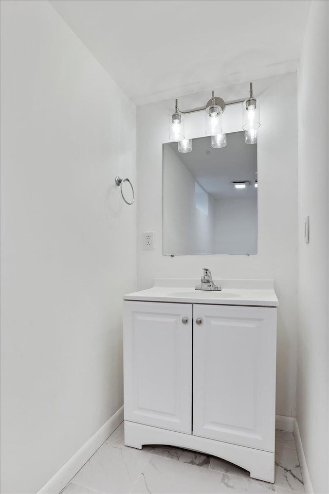 210 Jackson Ave, New Market, VA 22844 - bathroom featuring baseboards, marble look tiles, and vanity