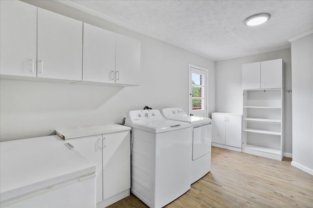 210 Jackson Ave, New Market, VA 22844 - laundry room with cabinet space, separate washer and dryer, light wood finished floors, and a textured ceiling