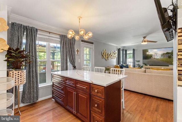 3227 Lancaster Ring Rd, Fredericksburg, VA 22408 - kitchen featuring light wood-style floors, crown molding, light countertops, pendant lighting, and ceiling fan