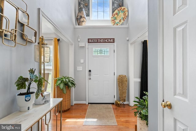 3227 Lancaster Ring Rd, Fredericksburg, VA 22408 - foyer with a high ceiling, light wood-style flooring, and baseboards