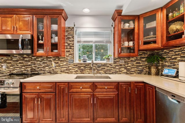 3227 Lancaster Ring Rd, Fredericksburg, VA 22408 - kitchen featuring appliances with stainless steel finishes, a sink, light countertops, and tasteful backsplash
