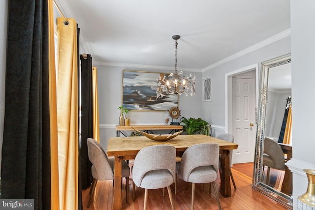 3227 Lancaster Ring Rd, Fredericksburg, VA 22408 - dining area with ornamental molding, wood finished floors, and a chandelier