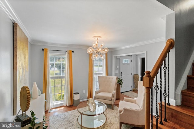 3227 Lancaster Ring Rd, Fredericksburg, VA 22408 - living area with wood finished floors, crown molding, a chandelier, stairway, and baseboards