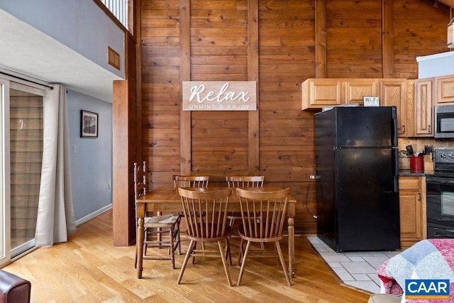 16 Chestnut Ln, Wintergreen Resort, VA 22967 - dining area featuring wooden walls and light wood-style flooring