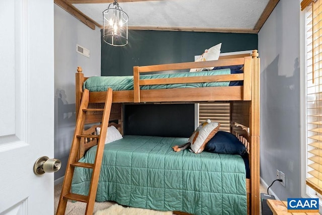 16 Chestnut Ln, Wintergreen Resort, VA 22967 - bedroom with crown molding, visible vents, multiple windows, and baseboards