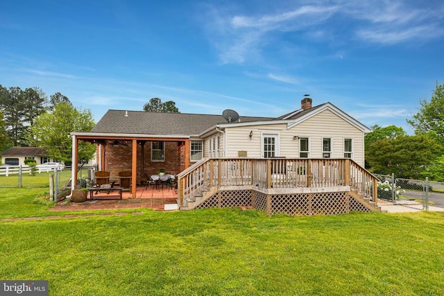 rear view of property featuring a patio, a deck, a chimney, stairs, and a gate