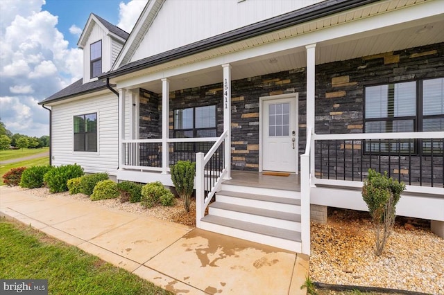 15411 Cedar Hill Dr, Mineral, VA 23117 - doorway to property featuring covered porch and stone siding