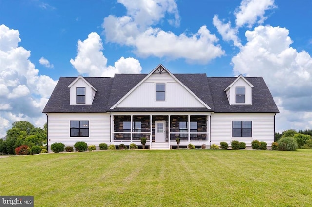 15411 Cedar Hill Dr, Mineral, VA 23117 - modern farmhouse style home featuring a front yard, a shingled roof, and a sunroom