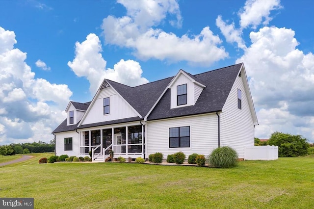 15411 Cedar Hill Dr, Mineral, VA 23117 - new england style home featuring a sunroom, a front lawn, and roof with shingles